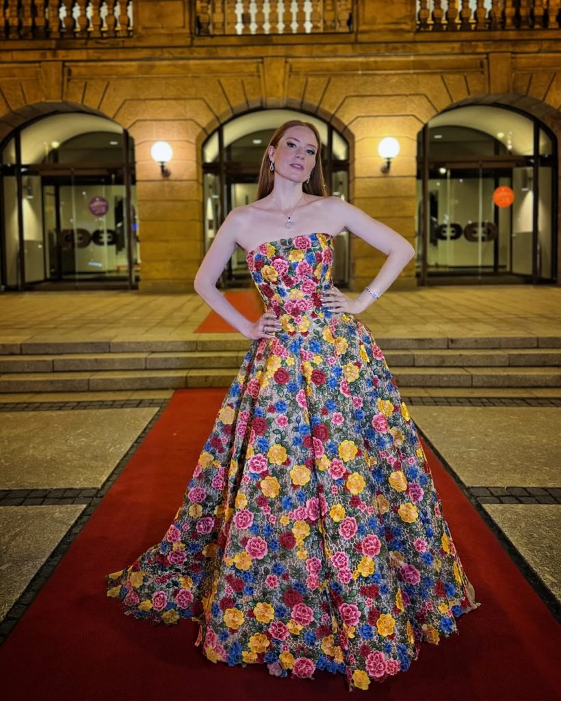 Barbara Meier in a vibrant floral dress at the Europäischen Kulturpreis