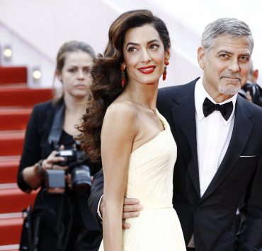 A striking entrance: Amal and George Clooney on the red carpet in London