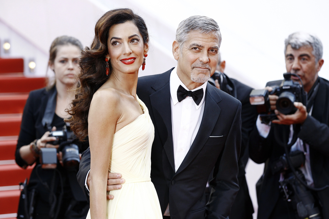 A striking entrance: Amal and George Clooney on the red carpet in London